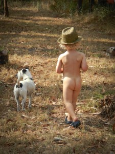 Felix takes Skipper out and about in the bush.  Crocs and a hat - that's all a guy needs! Photo credit M.Jenner