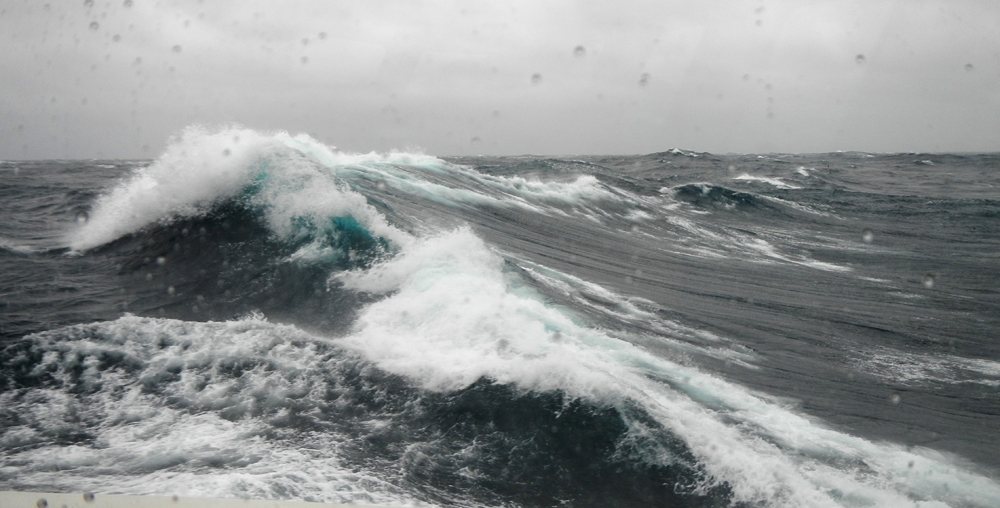 Wild waves photographed from the starboard window, I am neatly tucked inside the wheelhouse! Photo credit M. Jenner