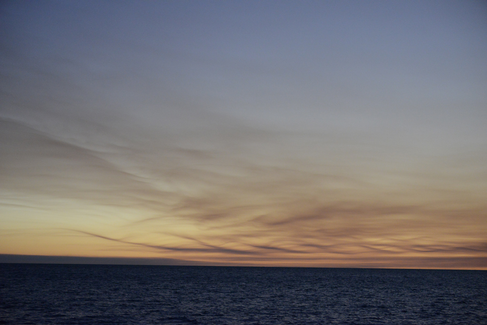 Burning fires shroud the horizon with swirling designs and interesting hues.