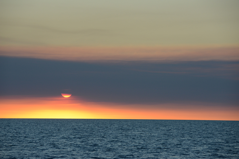 At least two wild bush fires filled the sky with smoke and ash giving the sunset an eerie feel.