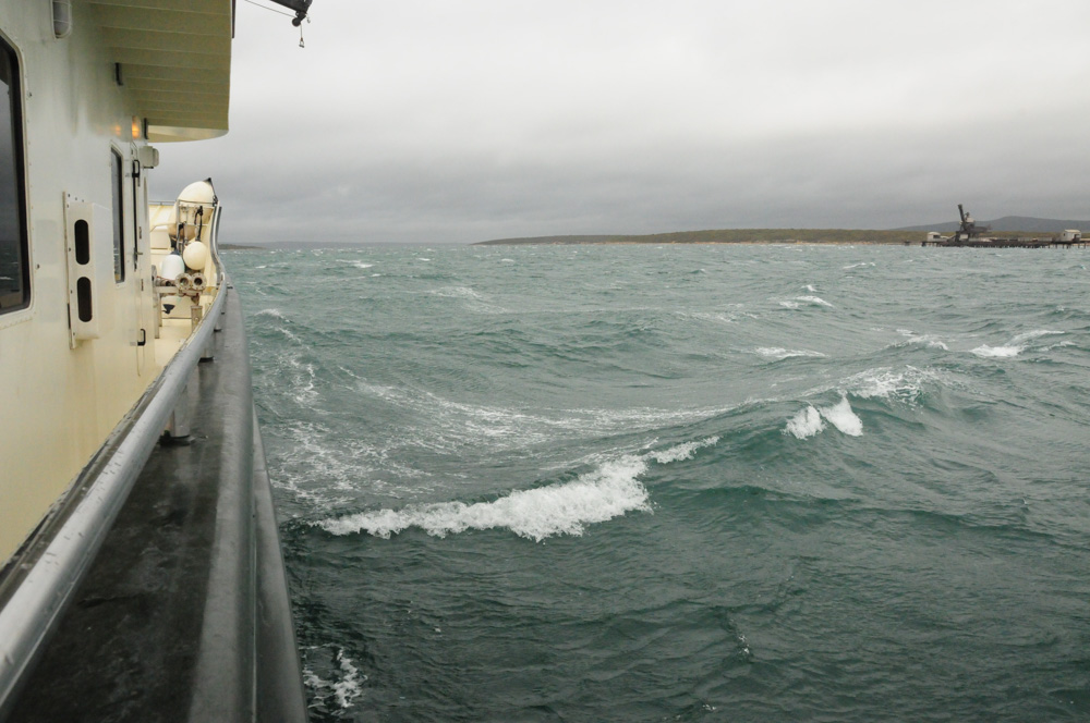 Breaking Waves in a Protected Bay. Ex-Tropical Cyclone Stan brings some wind, rain and cloud cover.